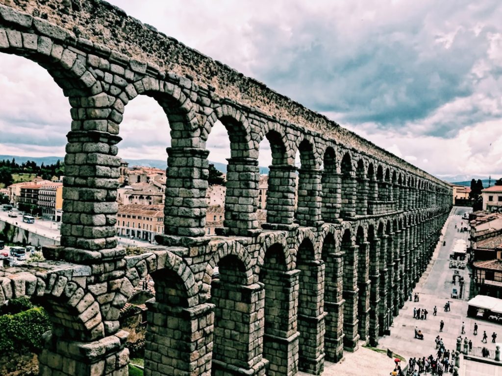 Image of the large, grey stone aqueduct in Segovia, Spain
