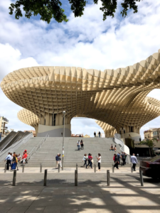 The futuristic-looking Las Setas de la Encarnación structure, which is beige with rounded edges and looks almost like a cubic mesh material. 